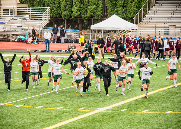 The girls soccer team celebrates their shoot-out win against Enumclaw which qualified them for state.