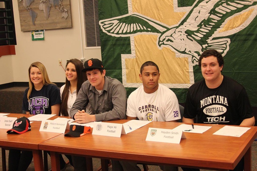 Five+PHS+students+signing+their+letters+of+intent.+