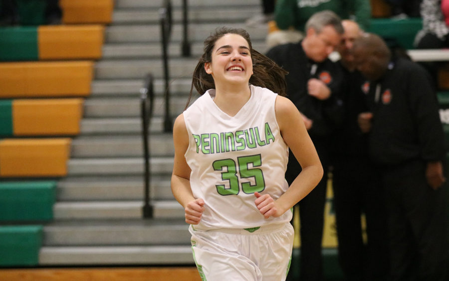 Belle Frazier heads off the court with a big smile.