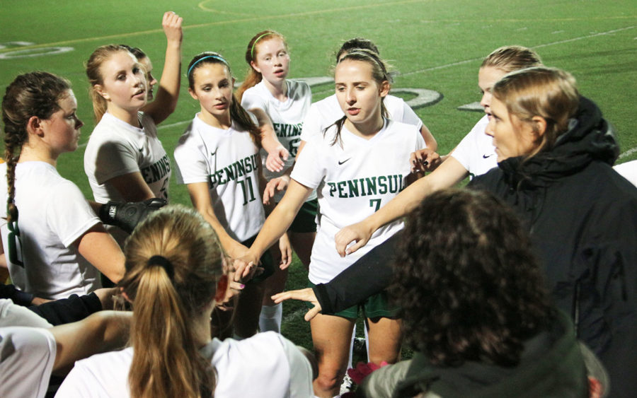 The Peninsula Ladies Soccer Team cheering before storing the field