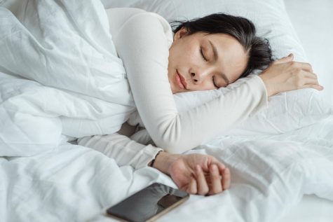 https://www.pexels.com/photo/woman-sleeping-in-bed-near-smartphone-4473864/