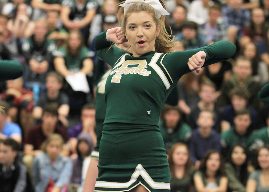 Varsity captain, Caroleann Tiedeman, cheers at a PHS assembly.