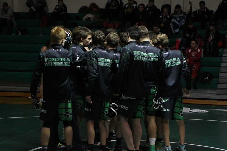 Wrestlers Huddling before the matches