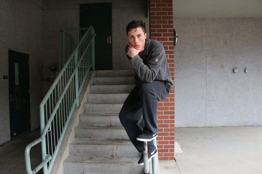 Josh Nicholas is caught off guard while sitting on a railing.